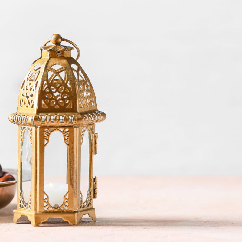 Muslim lamp and dates on light background